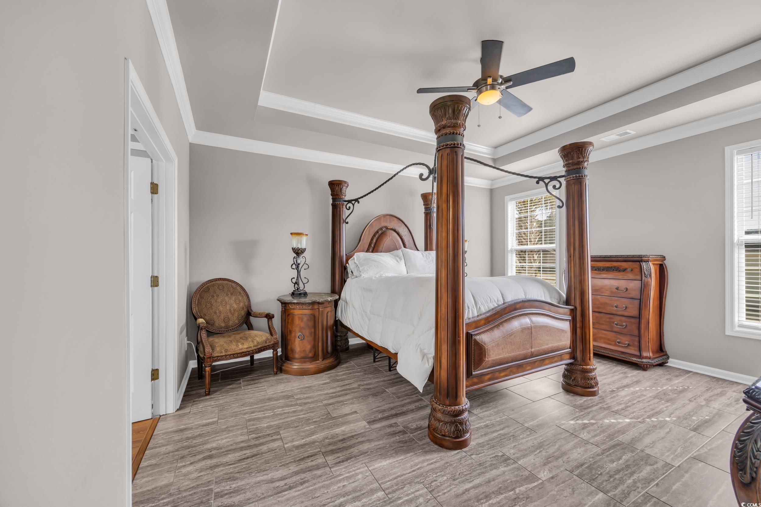 2385 Windmill Way Myrtle Beach, SC 29579 - Photo 24 of 39 Bedroom featuring crown molding, a raised ceiling,