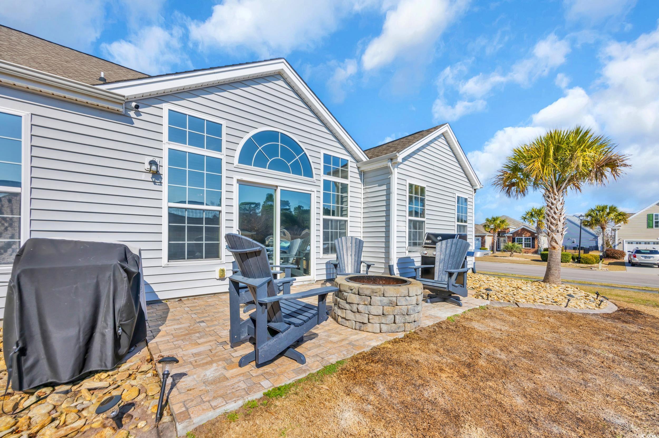 2385 Windmill Way Myrtle Beach, SC 29579 - Photo 35 of 39 Rear view of property featuring a tiled patio area