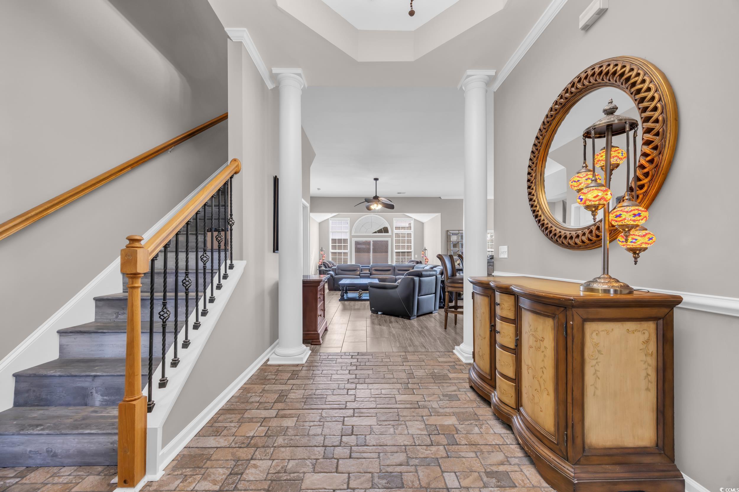 Entrance foyer with decorative columns and Chandel