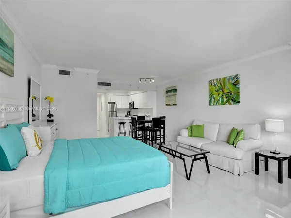 a kitchen with a refrigerator a sink and cabinets