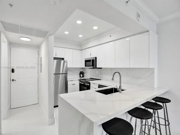 a bathroom with a shower and a mirror