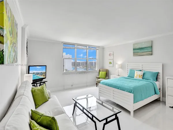 a bedroom with a bed and a couch