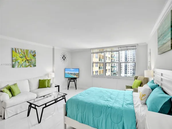 a bedroom with a bed and a chair