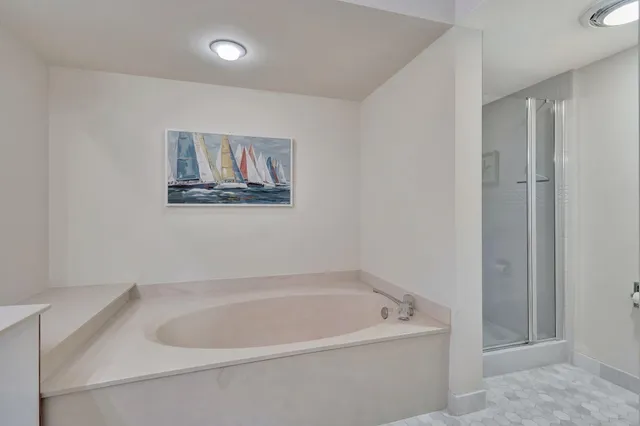 a bedroom with a bed and a mirror