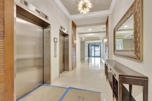 a kitchen with white cabinets sink and refrigerator