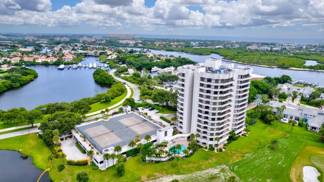an aerial view of a house with yard swimming pool and outdoor seating