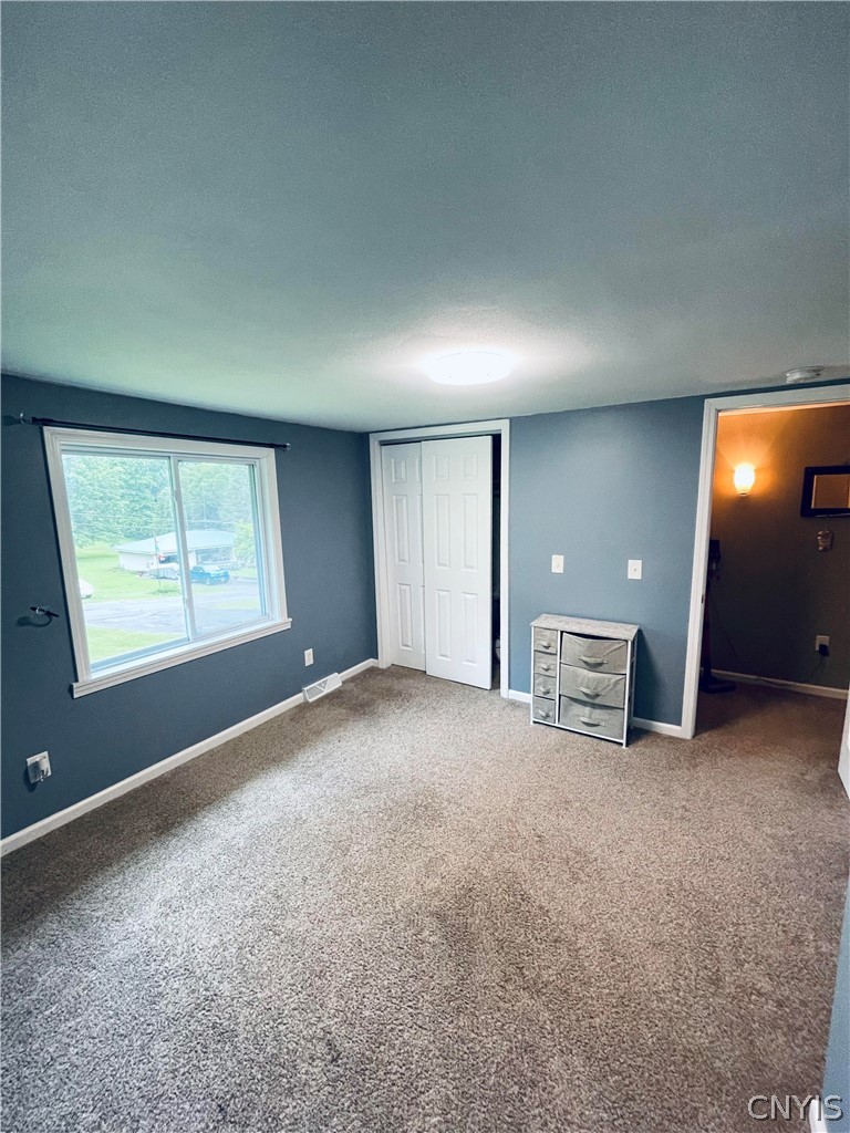 4982 Aitchison Road Onondaga, NY 13215 - Photo 18 of 26 Bedroom 2 looking back out into the hall