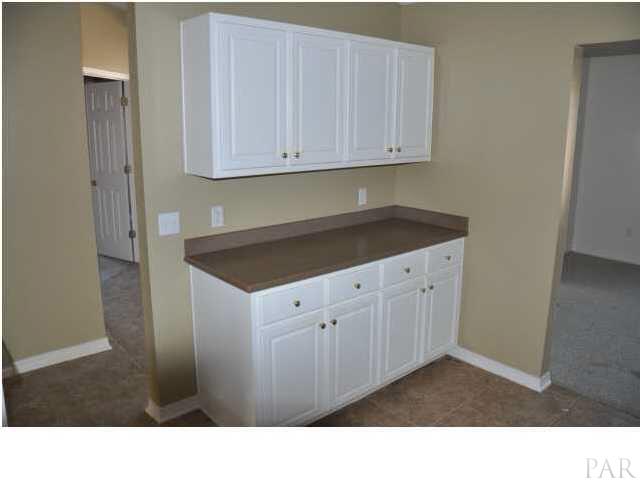 7147 Jennifer Road Pensacola, FL 32526 - Photo 5 of 11 Extra counter space and cabinets in kitchen: 7147 Jennifer Rd Pensacola FL