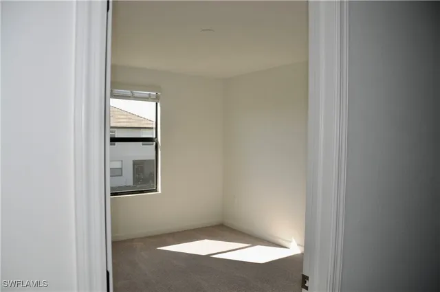 a view of an empty room and window