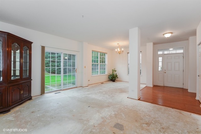 898 Riding Lane, Unit 898 St. Charles, IL 60174 - Photo 4 of 10 a view of an empty room with glass door and balcony