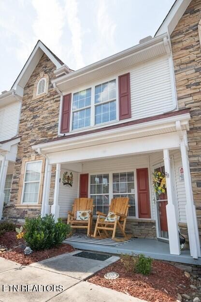 front view of a brick house with many windows