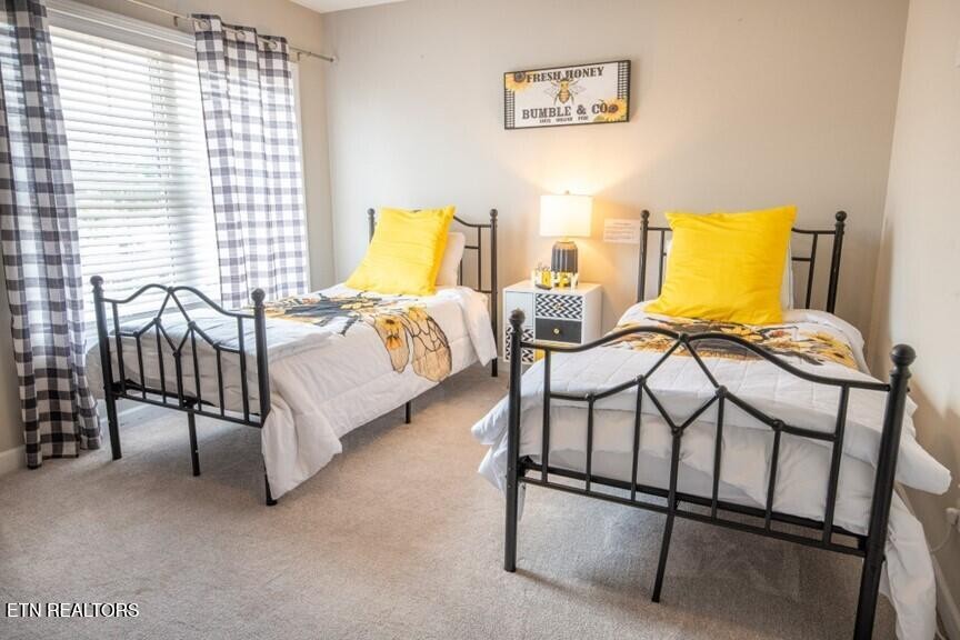 535 Orchard Valley Way Sevierville, TN 37862 - Photo 16 of 26 a bedroom with a bed and a window