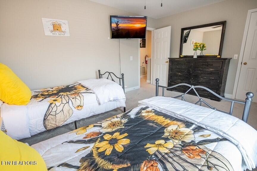 535 Orchard Valley Way Sevierville, TN 37862 - Photo 17 of 26 a bedroom with bed and flat screen tv