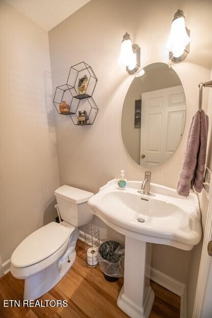 535 Orchard Valley Way Sevierville, TN 37862 - Photo 18 of 26 a bathroom with a toilet a sink and mirror