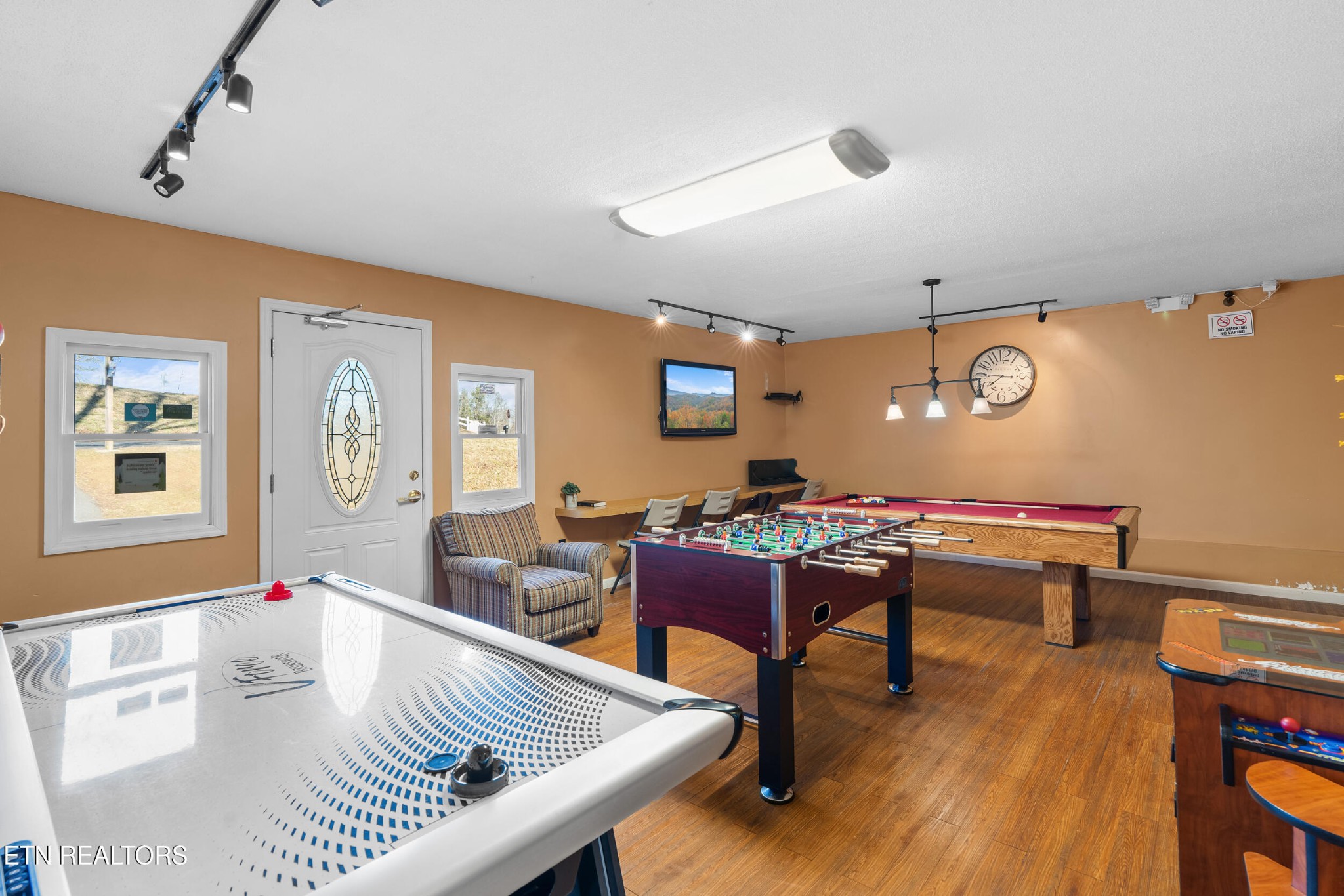 535 Orchard Valley Way Sevierville, TN 37862 - Photo 25 of 26 a living room with furniture and wooden floor