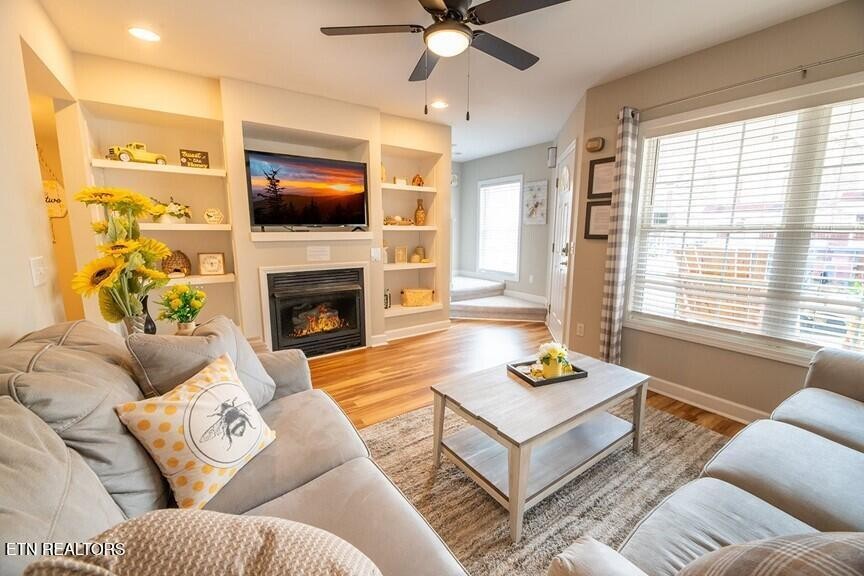 535 Orchard Valley Way Sevierville, TN 37862 - Photo 3 of 26 a living room with furniture and a flat screen tv