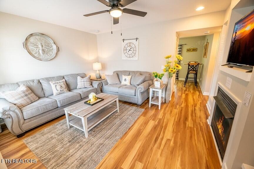 535 Orchard Valley Way Sevierville, TN 37862 - Photo 4 of 26 a living room with furniture and a flat screen tv