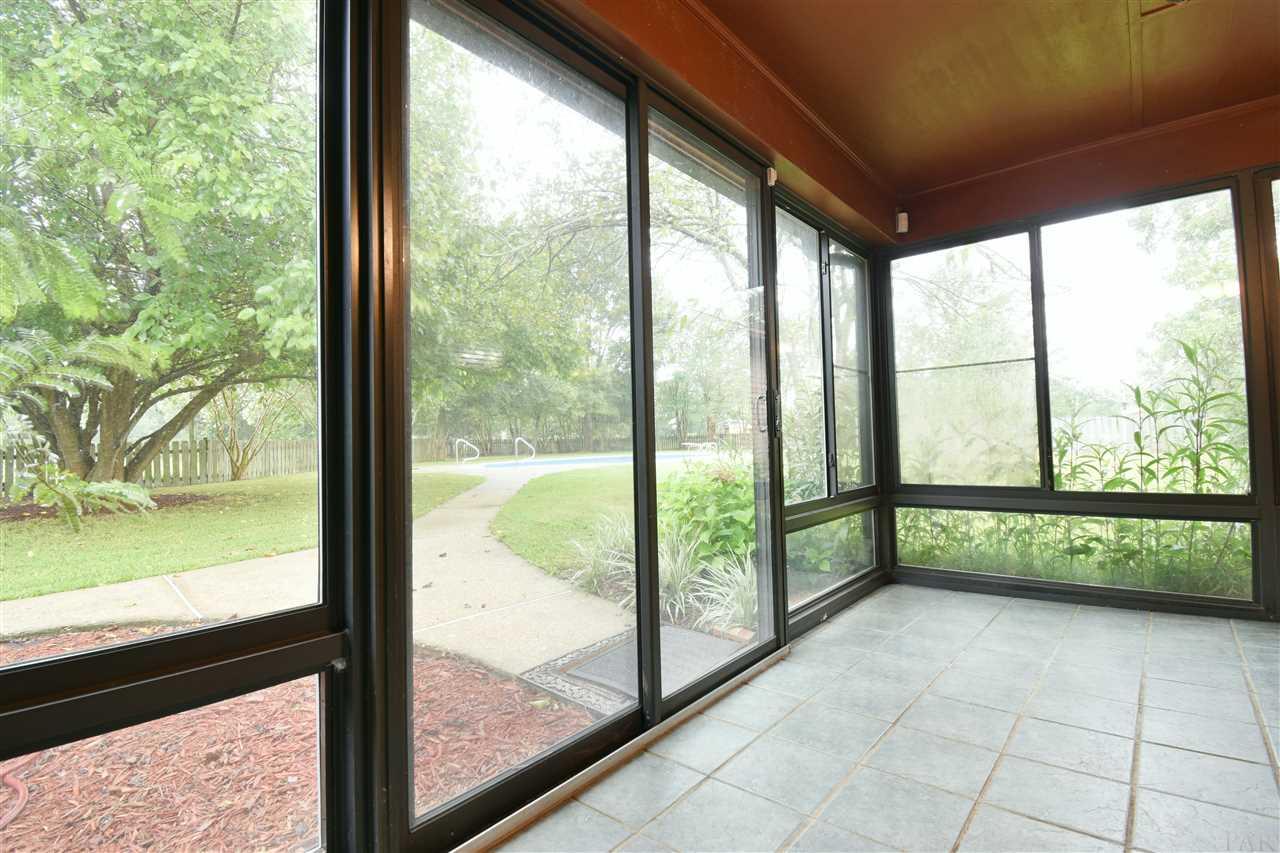 7035 Frank Reeder Road Pensacola, FL 32526 - Photo 16 of 47 Florida Room looking out at the pool