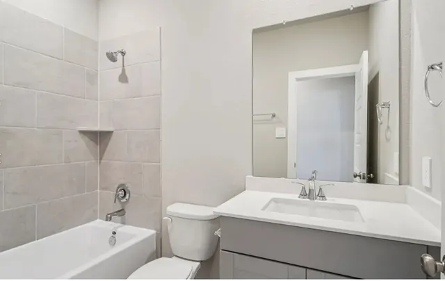 a bathroom with a sink toilet a shower and bathtub