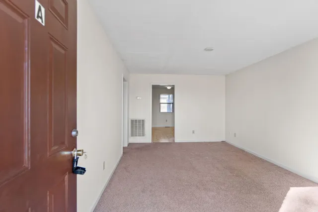 a view of an empty room and window