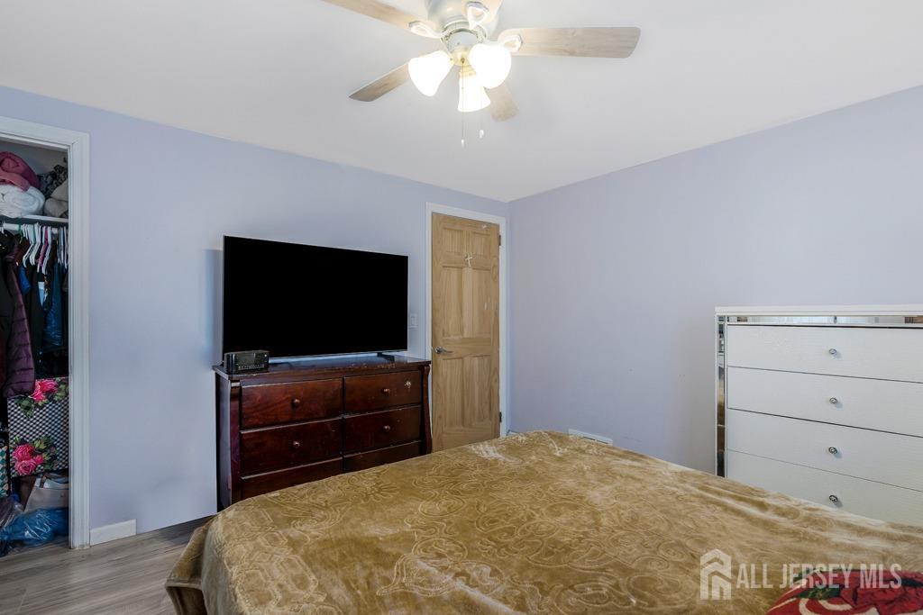 14 Grandview Street Middlesex, NJ 08846 - Photo 11 of 28 a bedroom with a bed and a flat screen tv