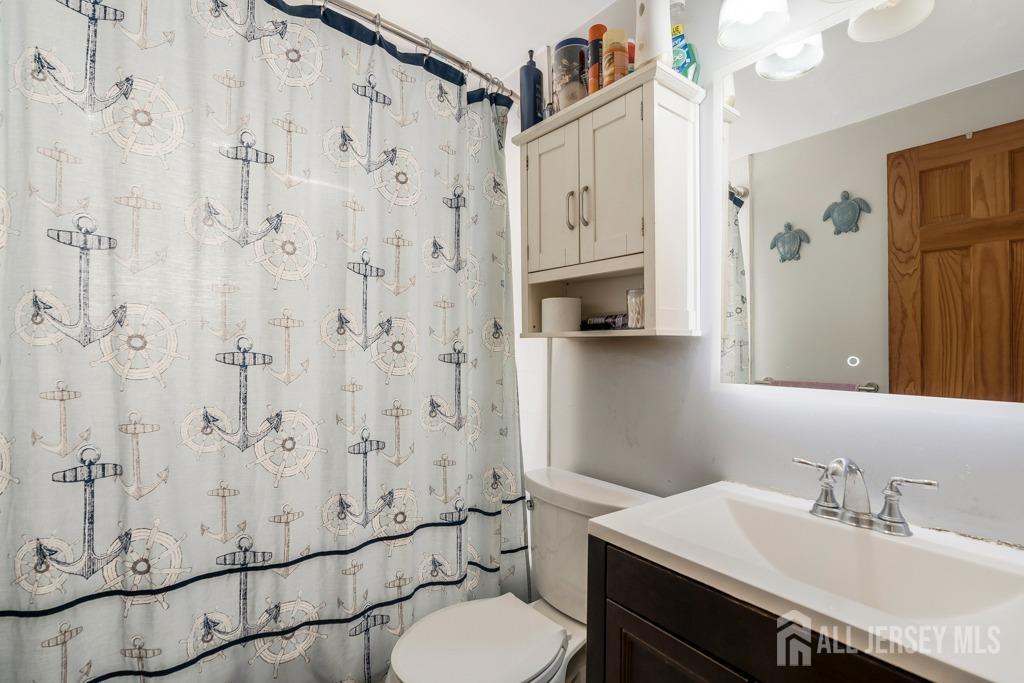 14 Grandview Street Middlesex, NJ 08846 - Photo 12 of 28 a bathroom with a sink toilet and shower
