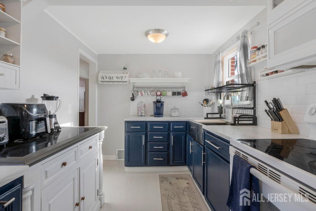 14 Grandview Street Middlesex, NJ 08846 - Photo 14 of 28 a kitchen with stainless steel appliances granite countertop a sink dishwasher stove and refrigerator