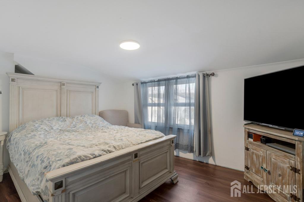 14 Grandview Street Middlesex, NJ 08846 - Photo 18 of 28 a bedroom with a bed and a flat screen tv