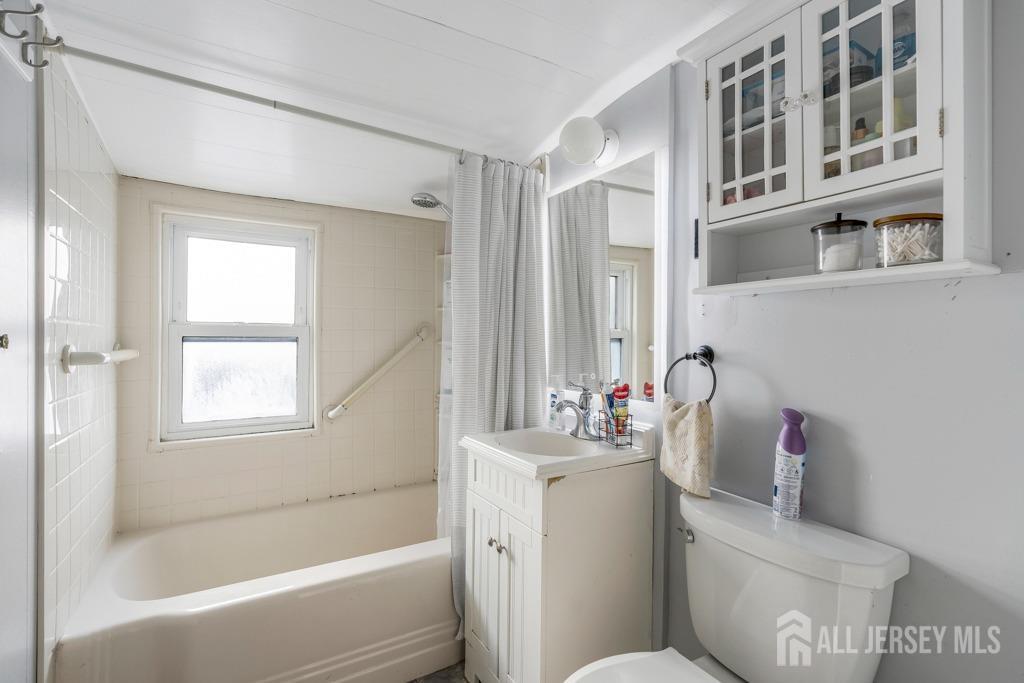 14 Grandview Street Middlesex, NJ 08846 - Photo 22 of 28 a bathroom with a sink mirror toilet and bathtub