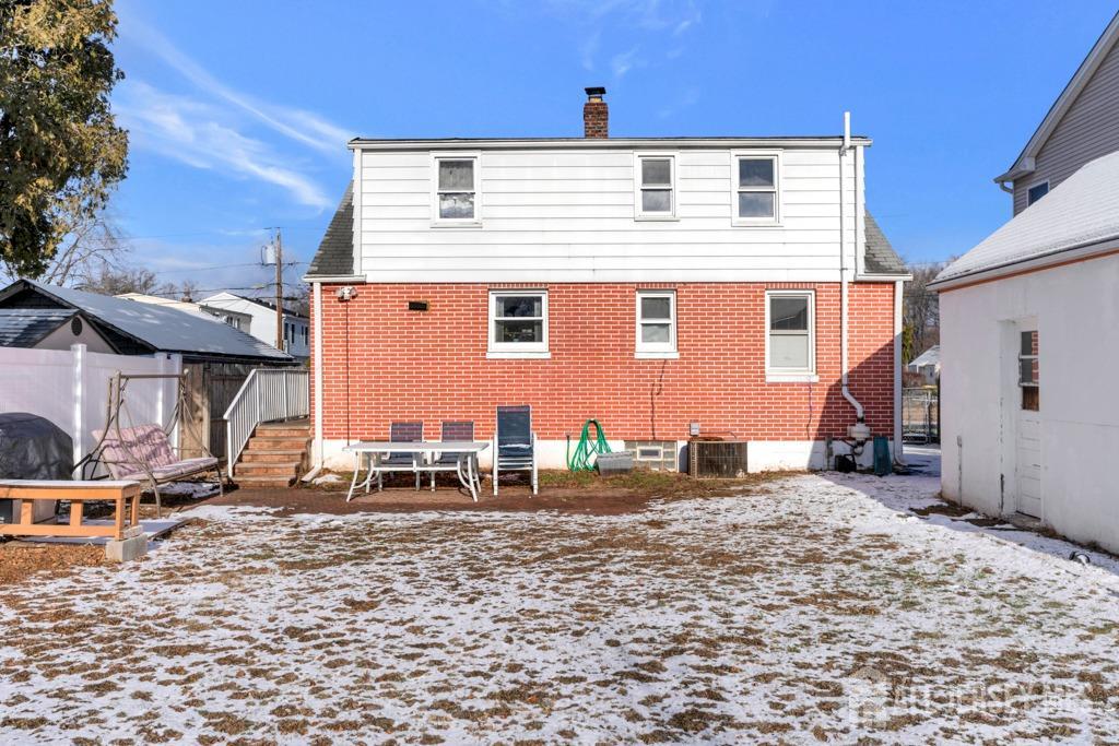 14 Grandview Street Middlesex, NJ 08846 - Photo 26 of 28 a backyard of a house with table and chairs