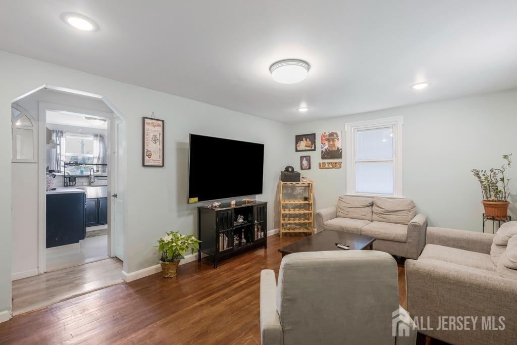 14 Grandview Street Middlesex, NJ 08846 - Photo 4 of 28 a living room with furniture and a flat screen tv