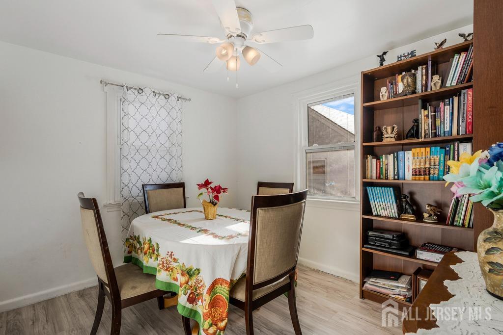 14 Grandview Street Middlesex, NJ 08846 - Photo 8 of 28 a view of a dining room with furniture and a book shelf