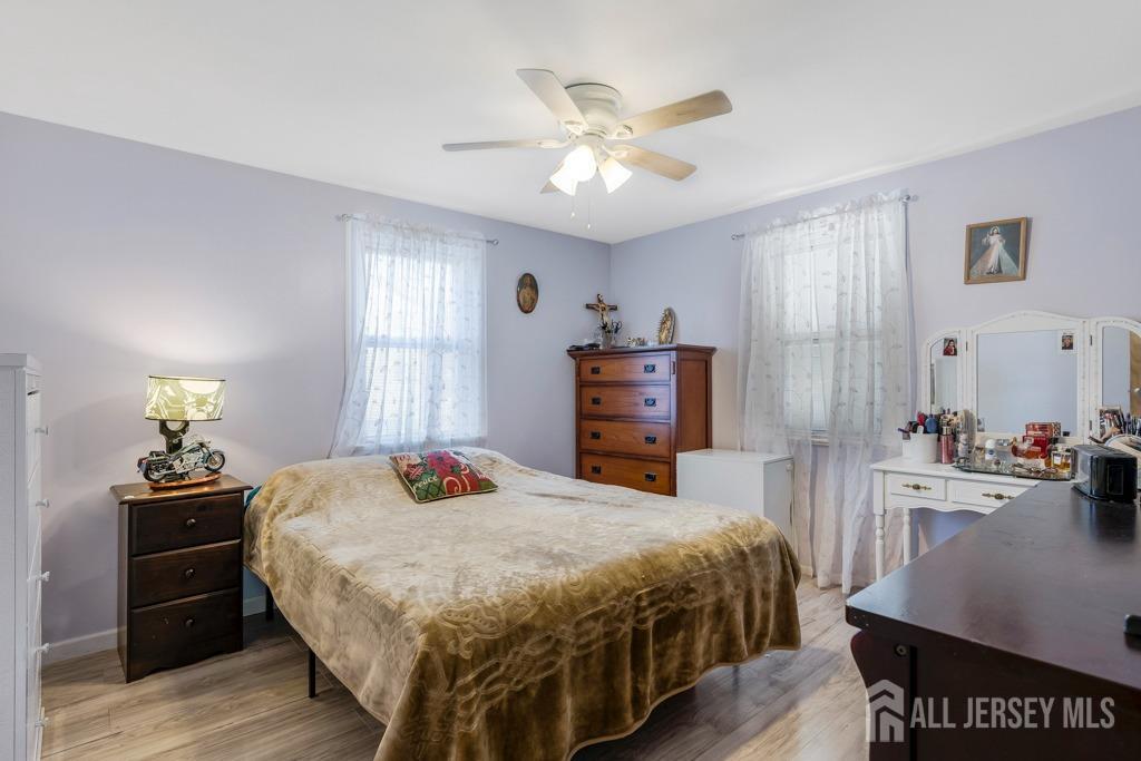 14 Grandview Street Middlesex, NJ 08846 - Photo 10 of 28 a bedroom with a bed and dresser with mirror