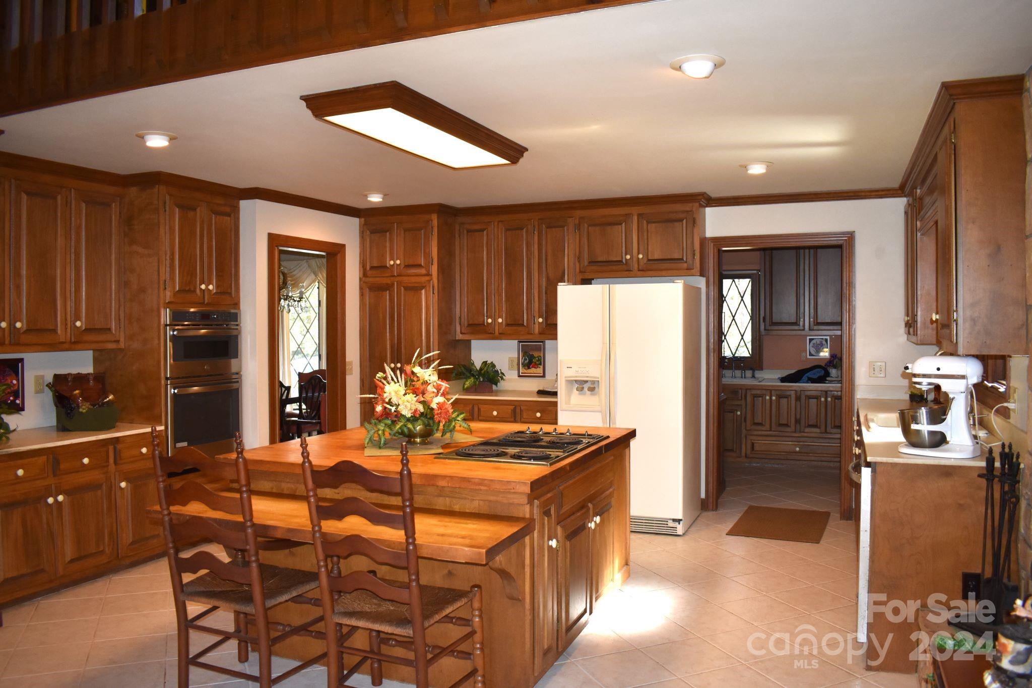 325 Regency Road Salisbury, NC 28147 - Photo 3 of 47 a kitchen with stainless steel appliances granite countertop a refrigerator and a stove top oven