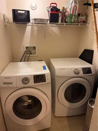 a utility room with dryer and washer
