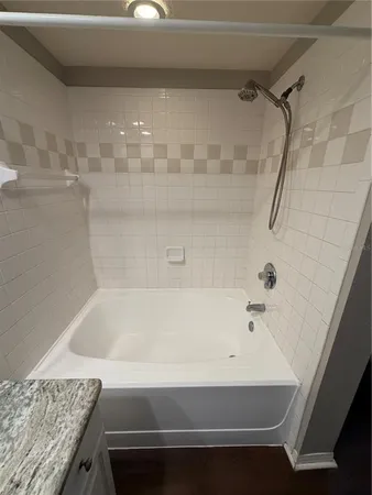 a bathroom with a bath tub