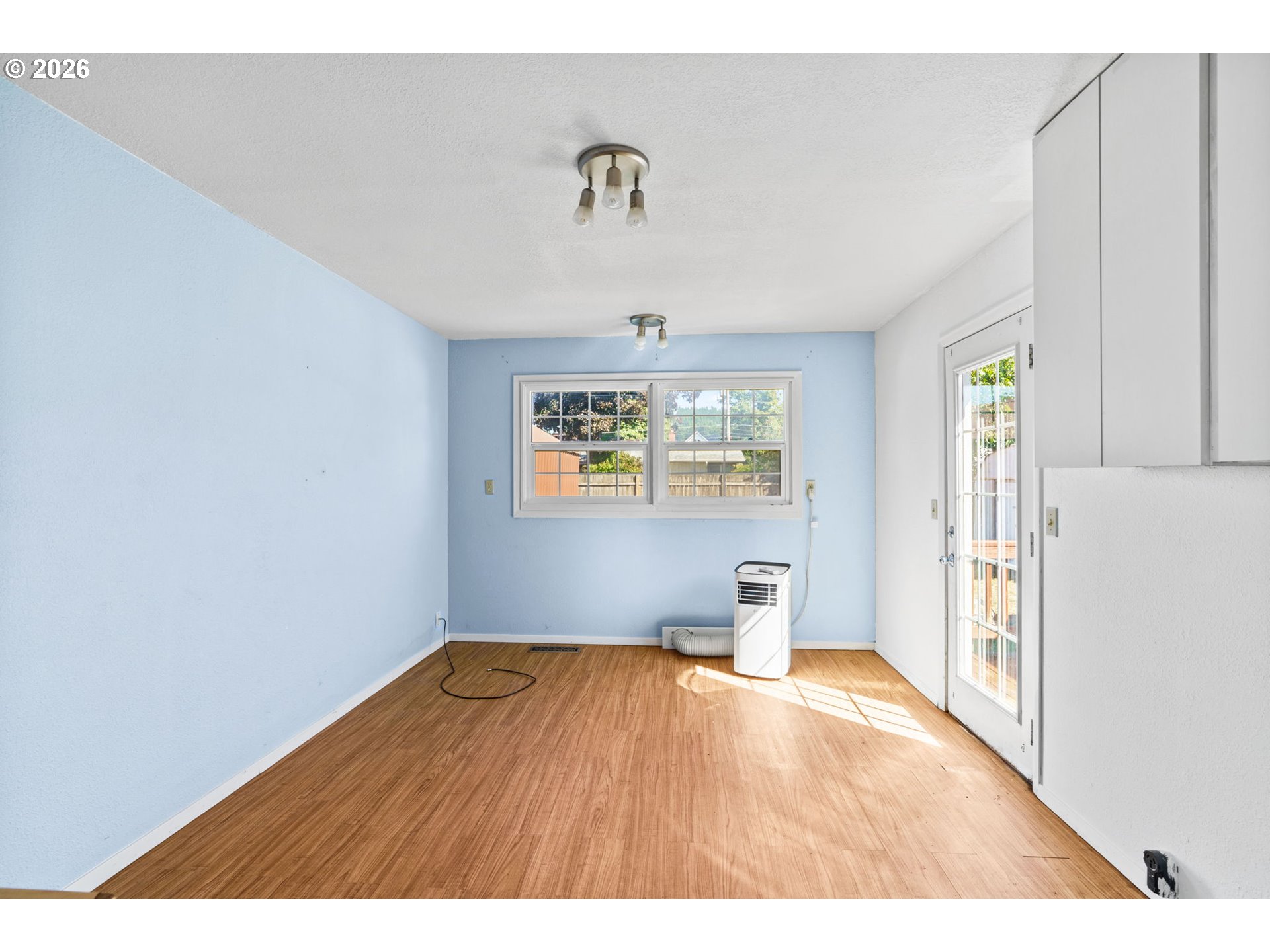 830 South 7th Street Cottage Grove, OR 97424 - Photo 12 of 33 a view of empty room with wooden floor