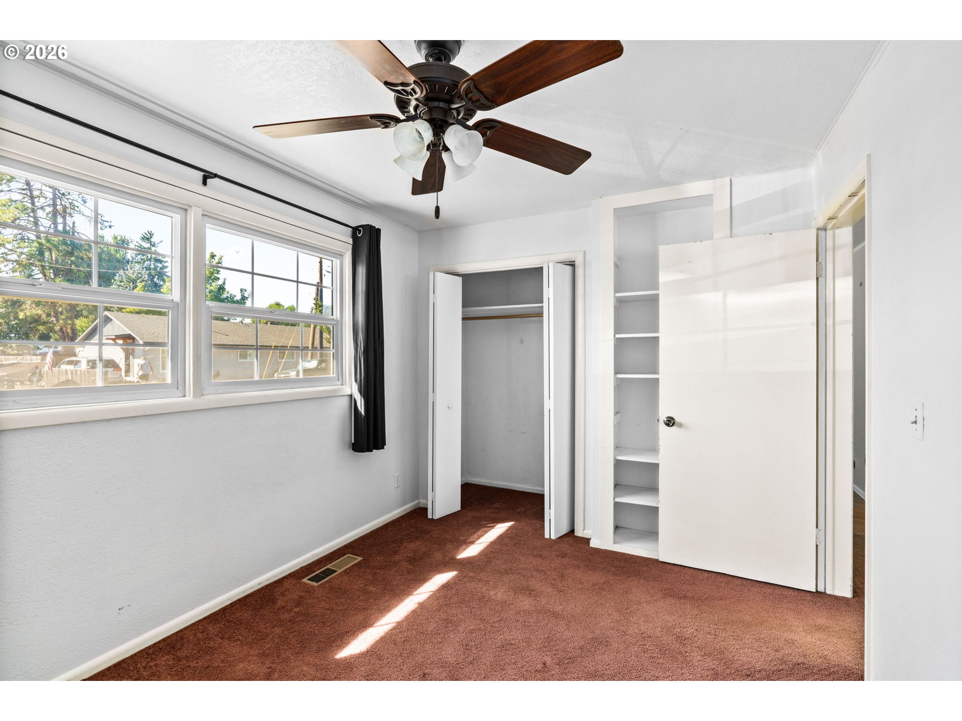 830 South 7th Street Cottage Grove, OR 97424 - Photo 14 of 33 a view of a livingroom with a ceiling fan and window