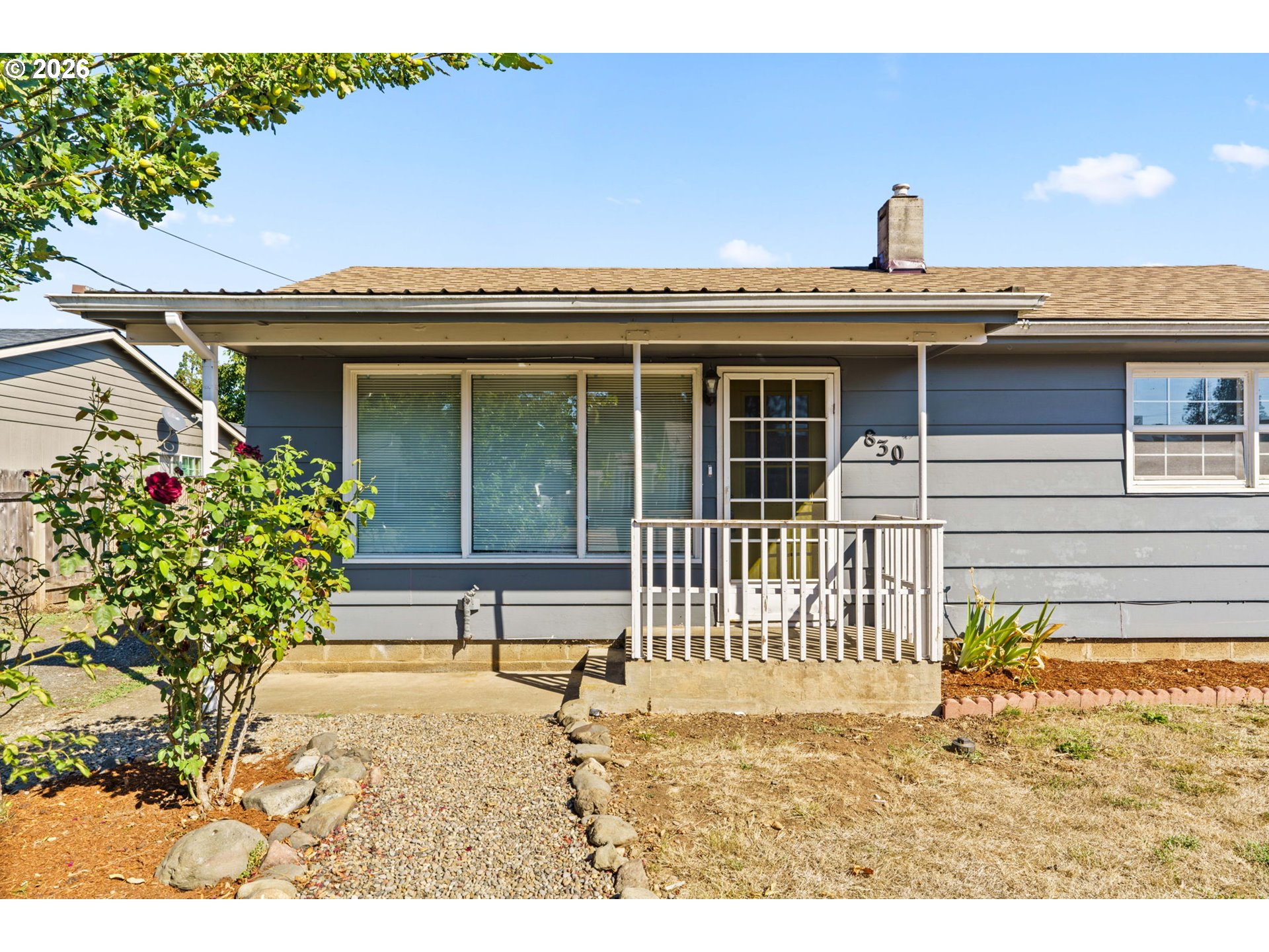 830 South 7th Street Cottage Grove, OR 97424 - Photo 2 of 33 a view of a house with a small yard and plants