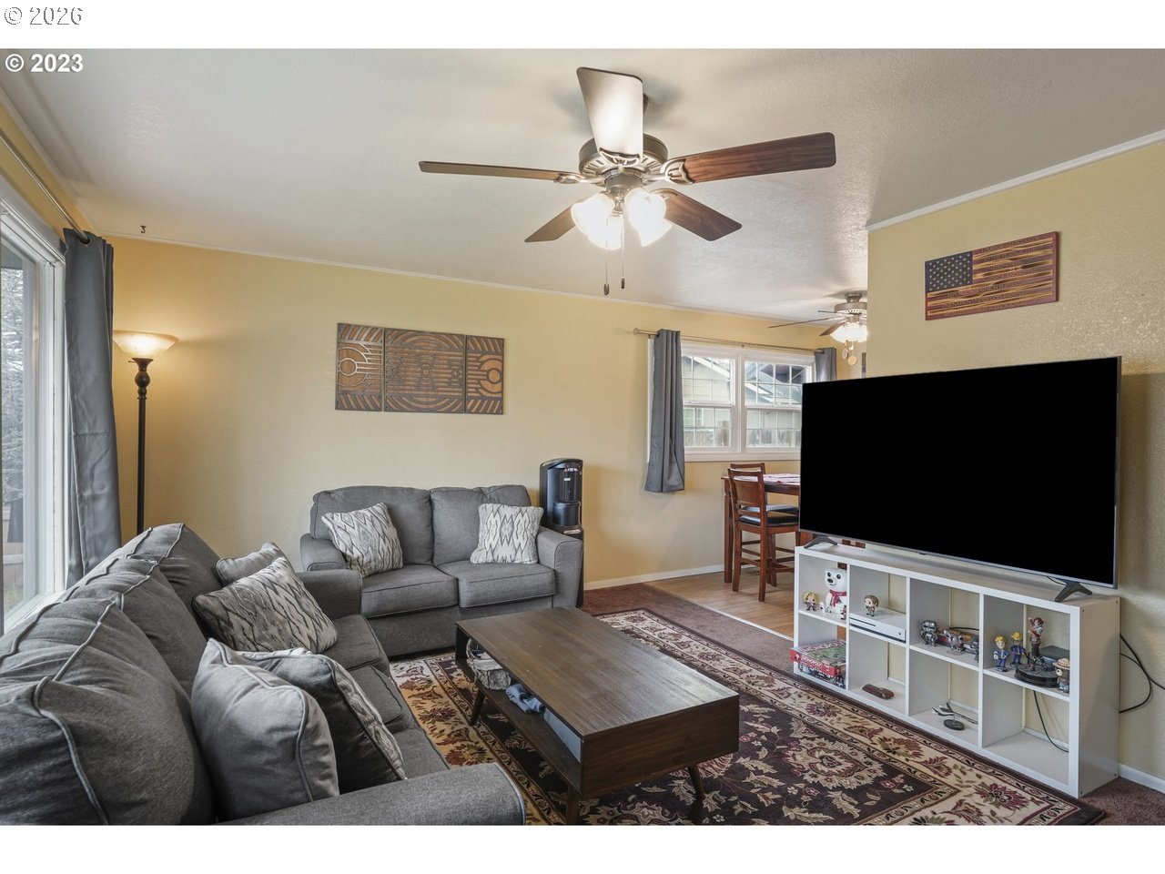 830 South 7th Street Cottage Grove, OR 97424 - Photo 21 of 33 a living room with furniture and a flat screen tv