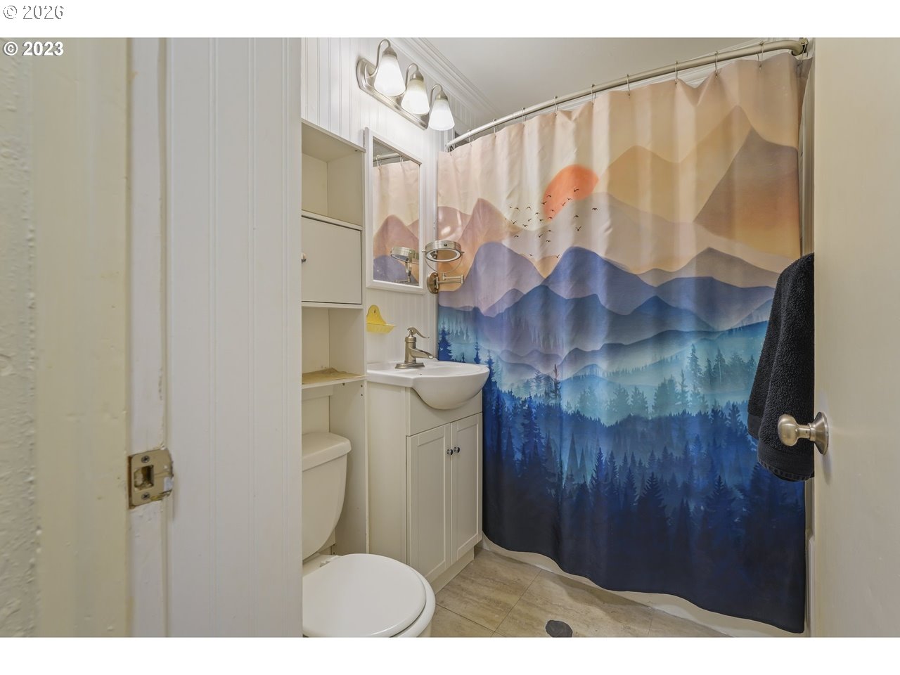 830 South 7th Street Cottage Grove, OR 97424 - Photo 22 of 33 a bathroom with a sink and mirror with toilet