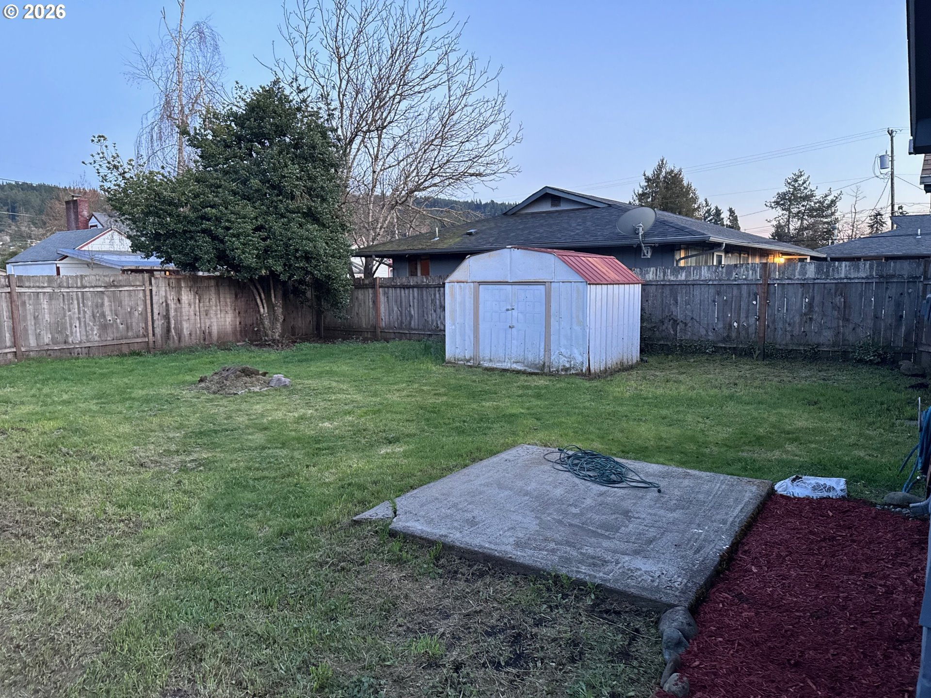 830 South 7th Street Cottage Grove, OR 97424 - Photo 29 of 33 a view of a backyard with wooden fence