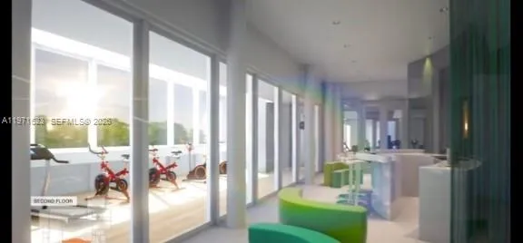 a living room with furniture and a floor to ceiling window