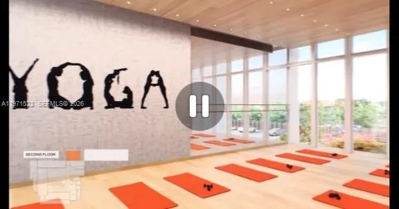 a bedroom with furniture and a large window