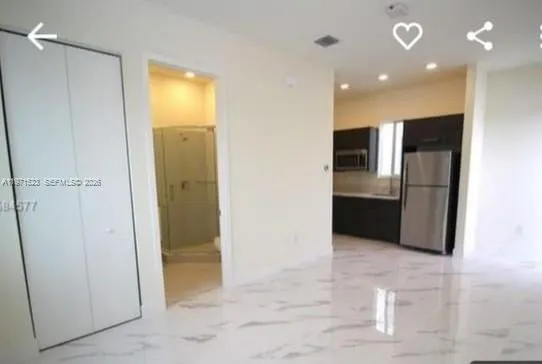 a view of a hallway with some storage area