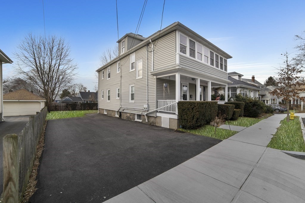 22 Ridgeway Street, Unit 2 Quincy, MA 02170 - Photo 13 of 15 a view of a house with a yard
