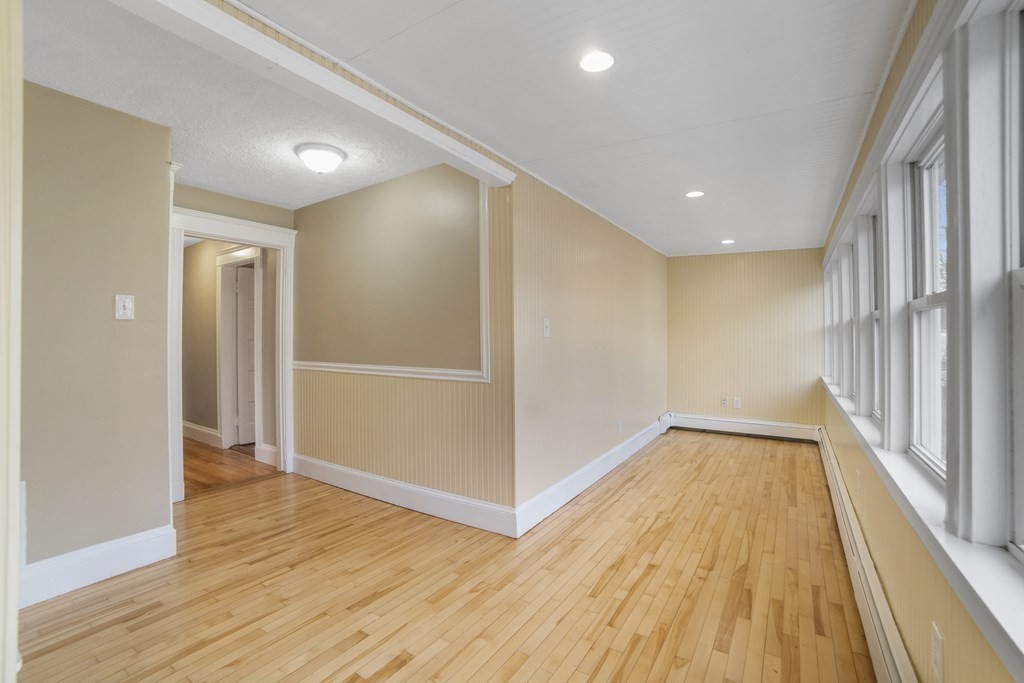 22 Ridgeway Street, Unit 2 Quincy, MA 02170 - Photo 5 of 15 a view of a hallway with wooden floor