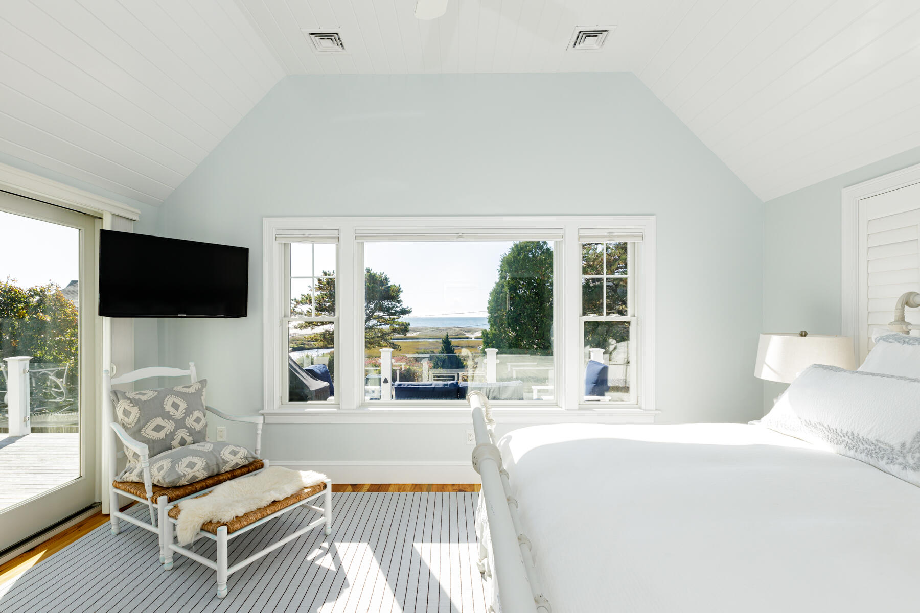 27 Patterson Road Chatham, MA 02633 - Photo 19 of 68 a living room with furniture a flat screen tv and a floor to ceiling window