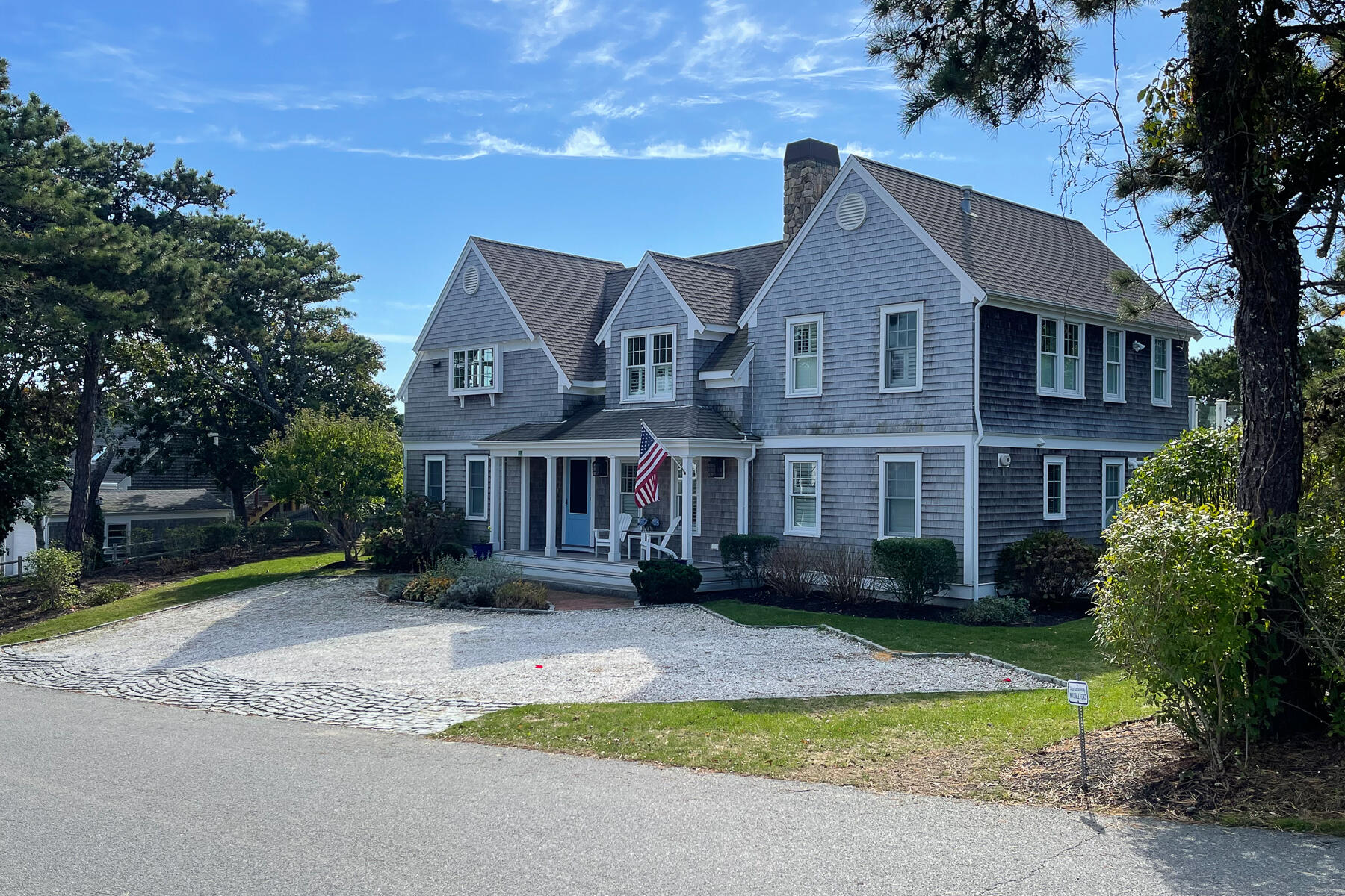 27 Patterson Road Chatham, MA 02633 - Photo 2 of 68 a front view of a house with a yard and trees