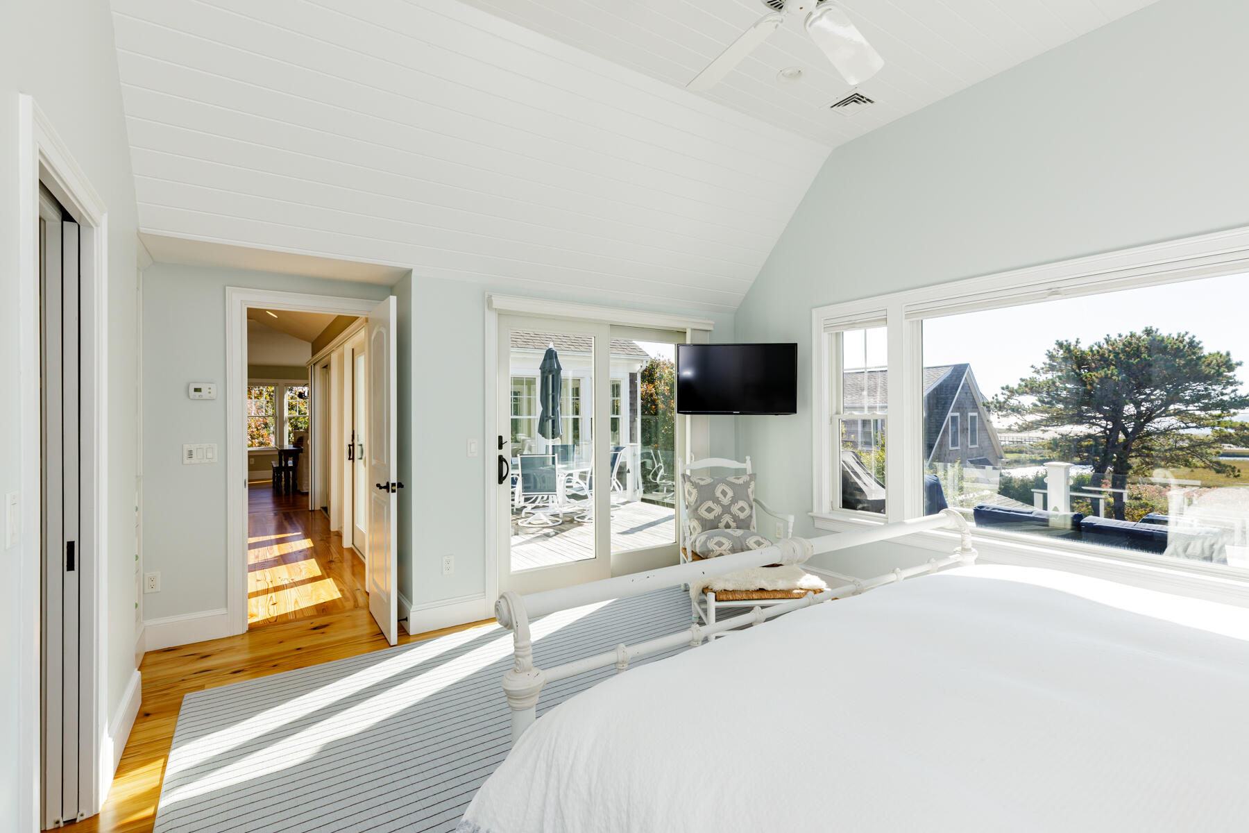 27 Patterson Road Chatham, MA 02633 - Photo 22 of 68 a bedroom with a bed and a large window with the outer view